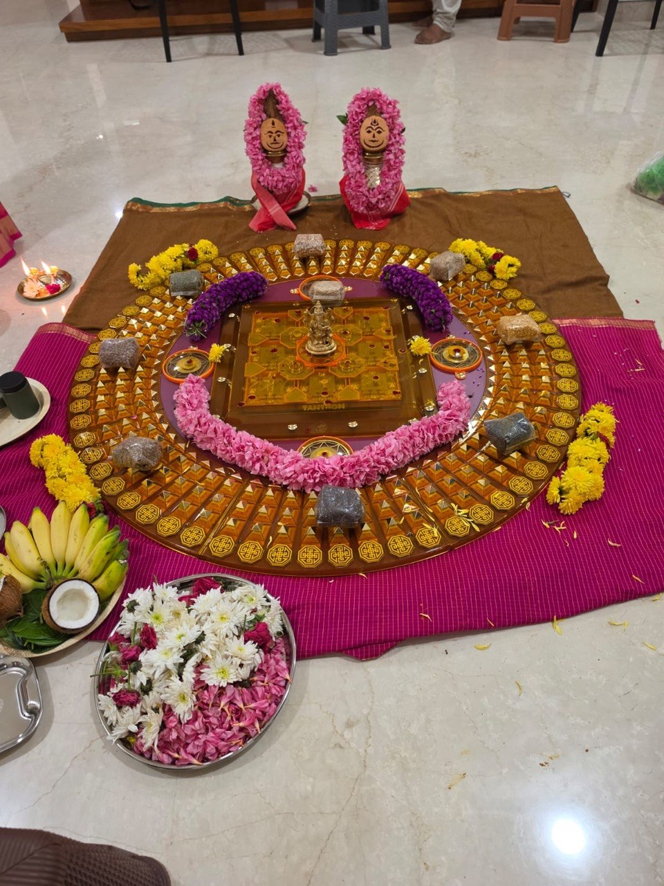 The TANTRON product arranged with flowers and offerings